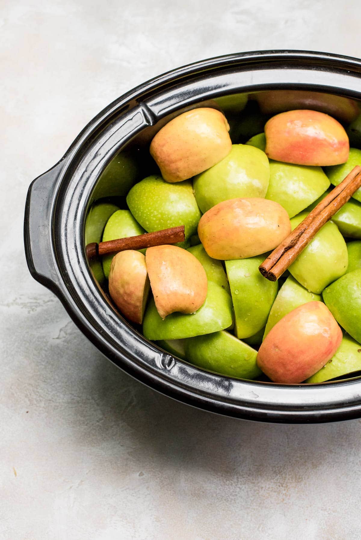 homemade apple cider prep apples in pot with cinnamon and water