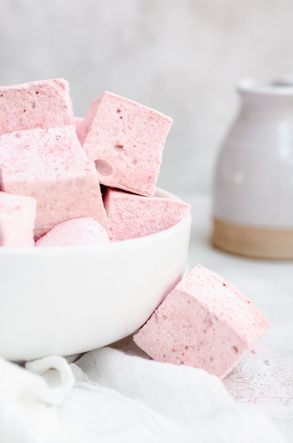 strawberry marshmallows in white bowl close up