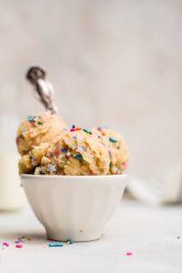 close up of edible cookie dough topped with sprinkles