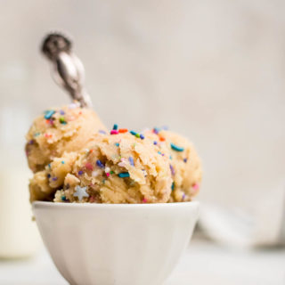 close up of edible cookie dough topped with sprinkles
