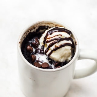 chocolate mug cake with scoop of vanilla ice cream