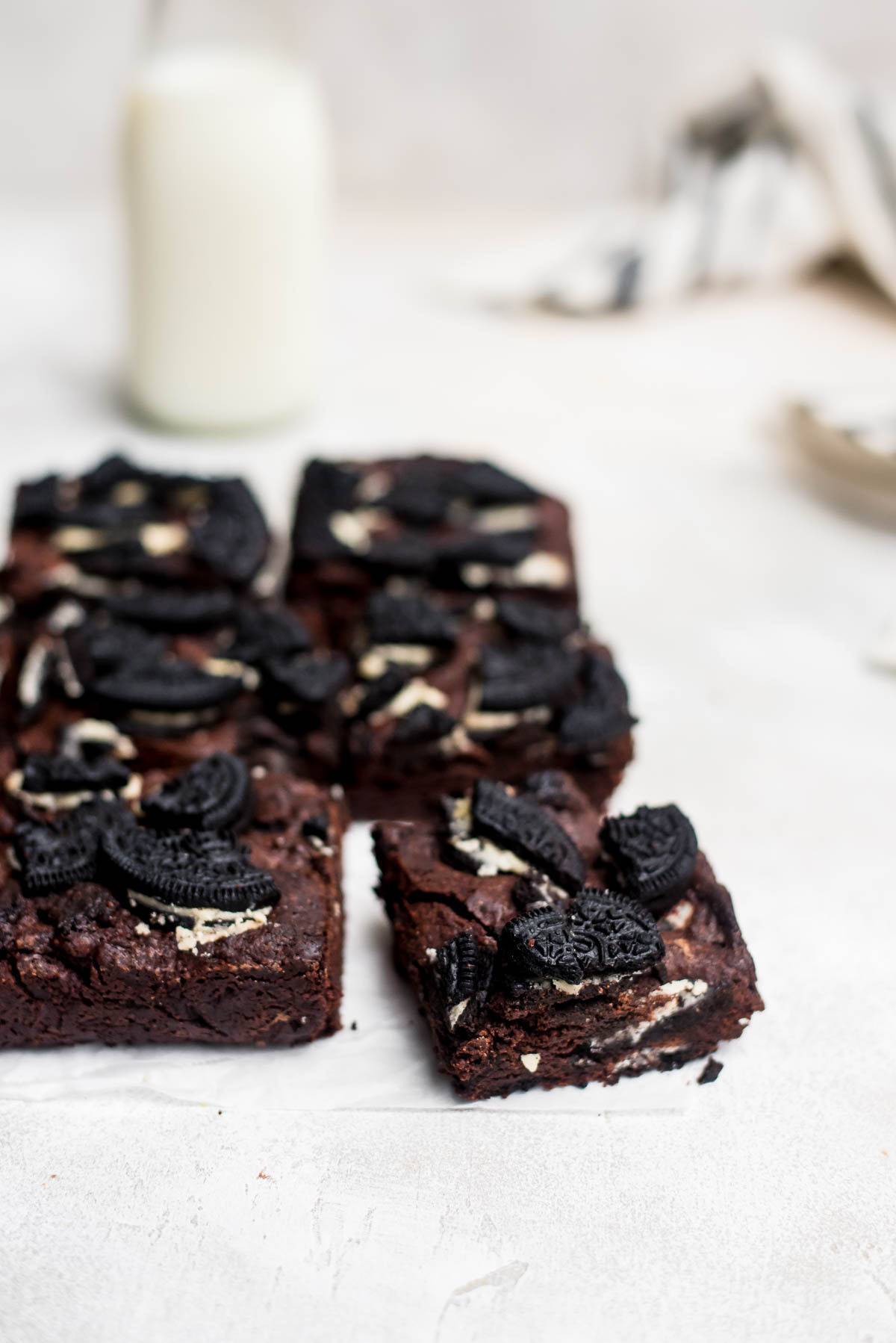 oreo brownies on parchment paper cut in squares