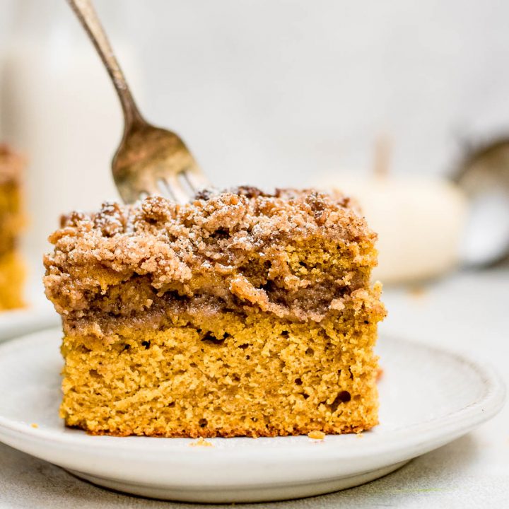 Close up pumpkin coffee cake with fork in cake
