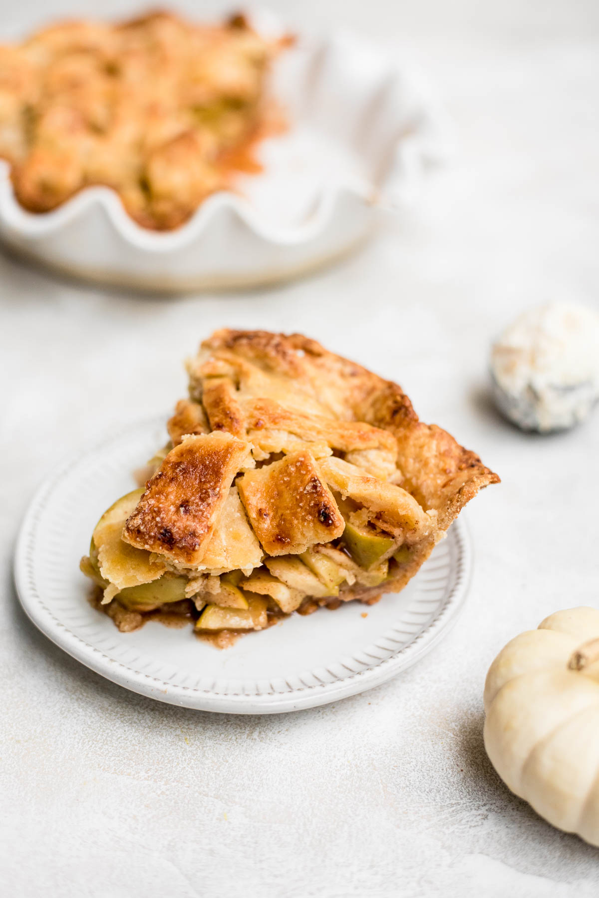 close up slice of apple pie showing layers of apples