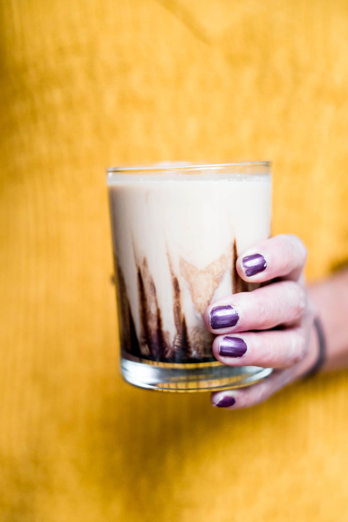 person holding peanut butter cocktail