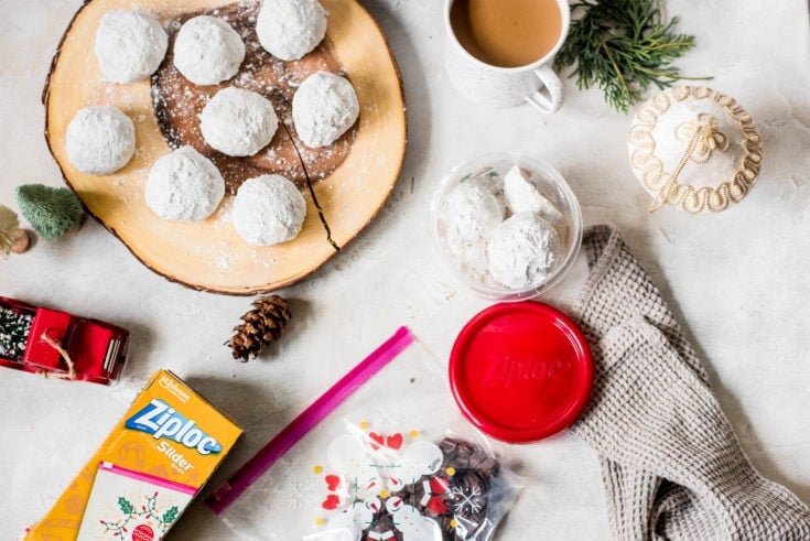 snowball cookies on wood board and coffee