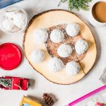 snowball cookies on wood board