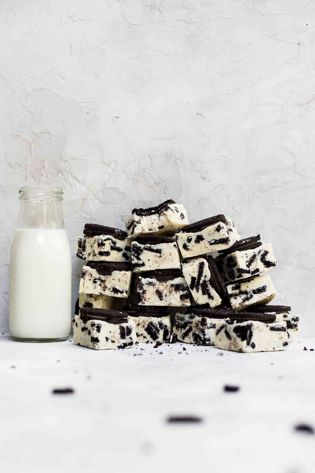 stacked oreo fudge next to milk