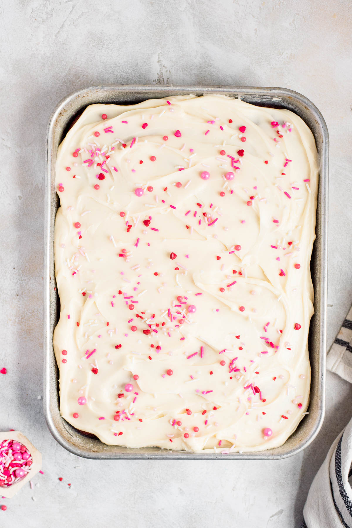 cream cheese frosting slathered on cake