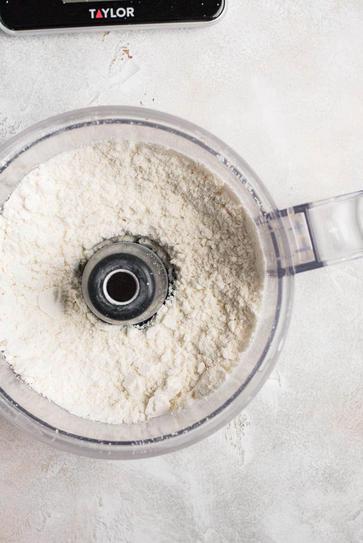 almond flour and powdered sugar mixed in food processor 
