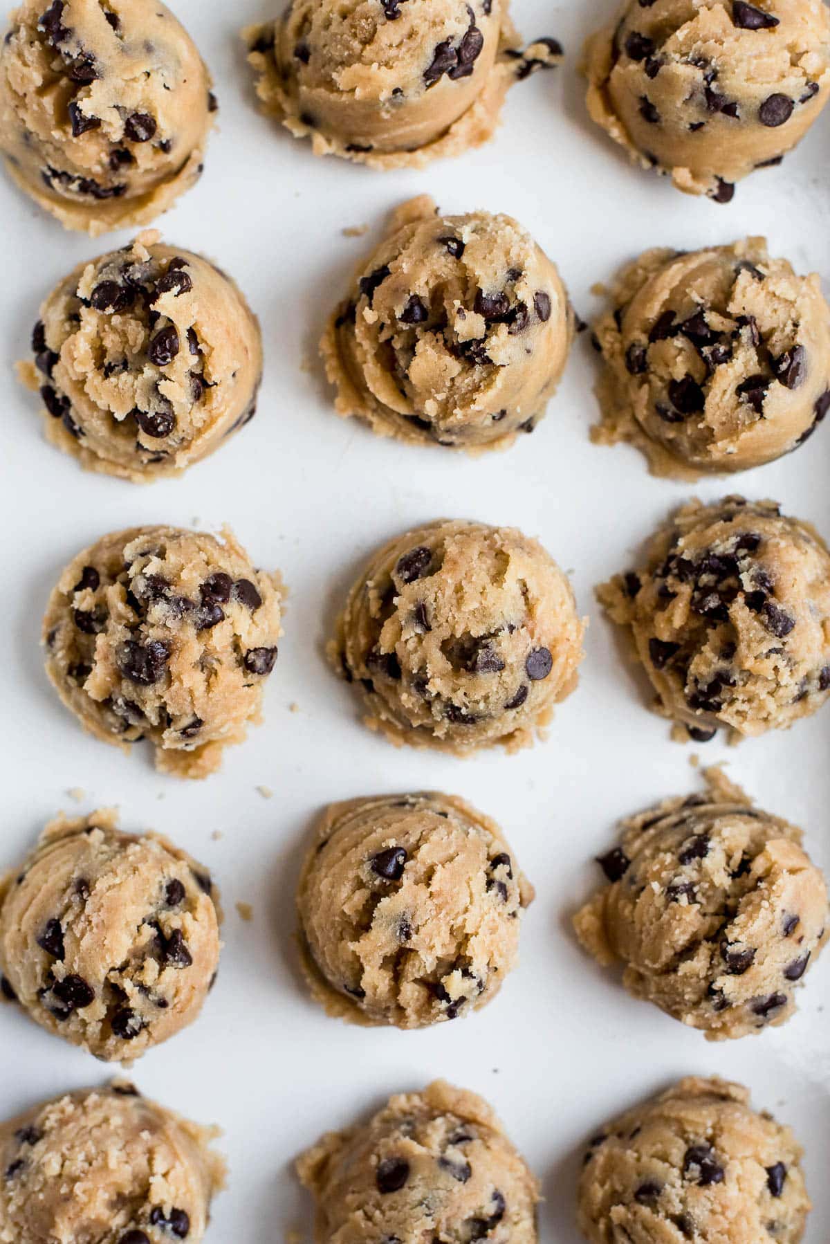 cookie dough scooped onto baking sheet close up