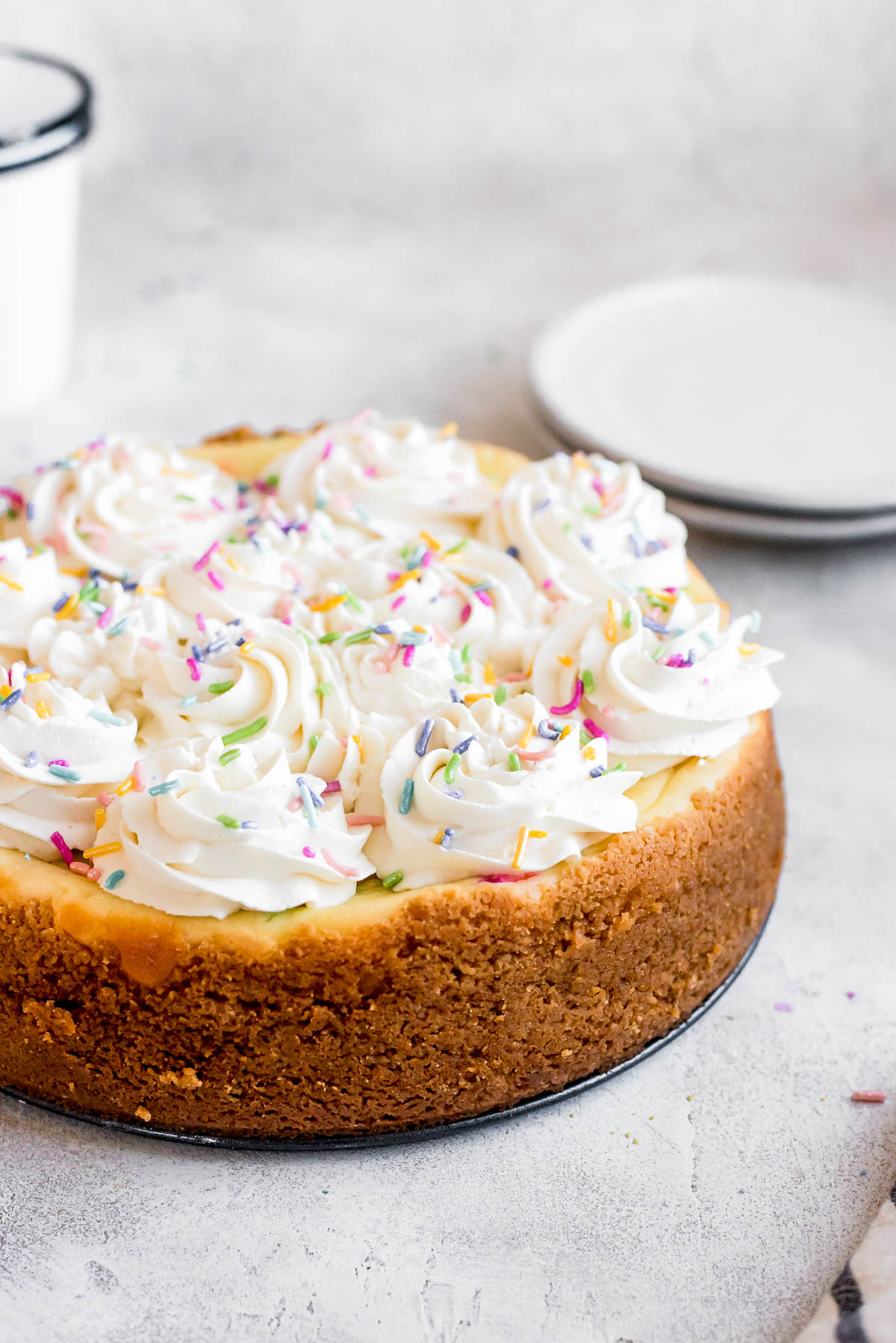 whole birthday cheesecake on plate