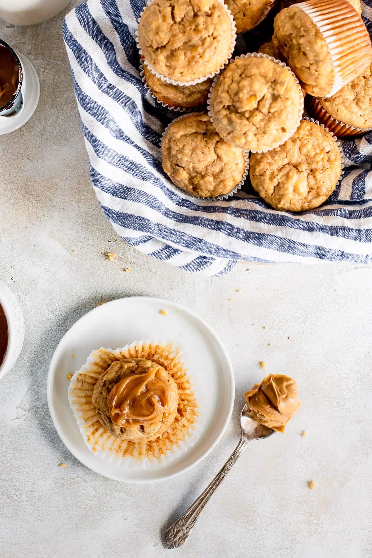 peanut butter banana muffins in bowl and one plate