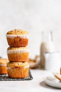 muffins stacked on one another on wire rack