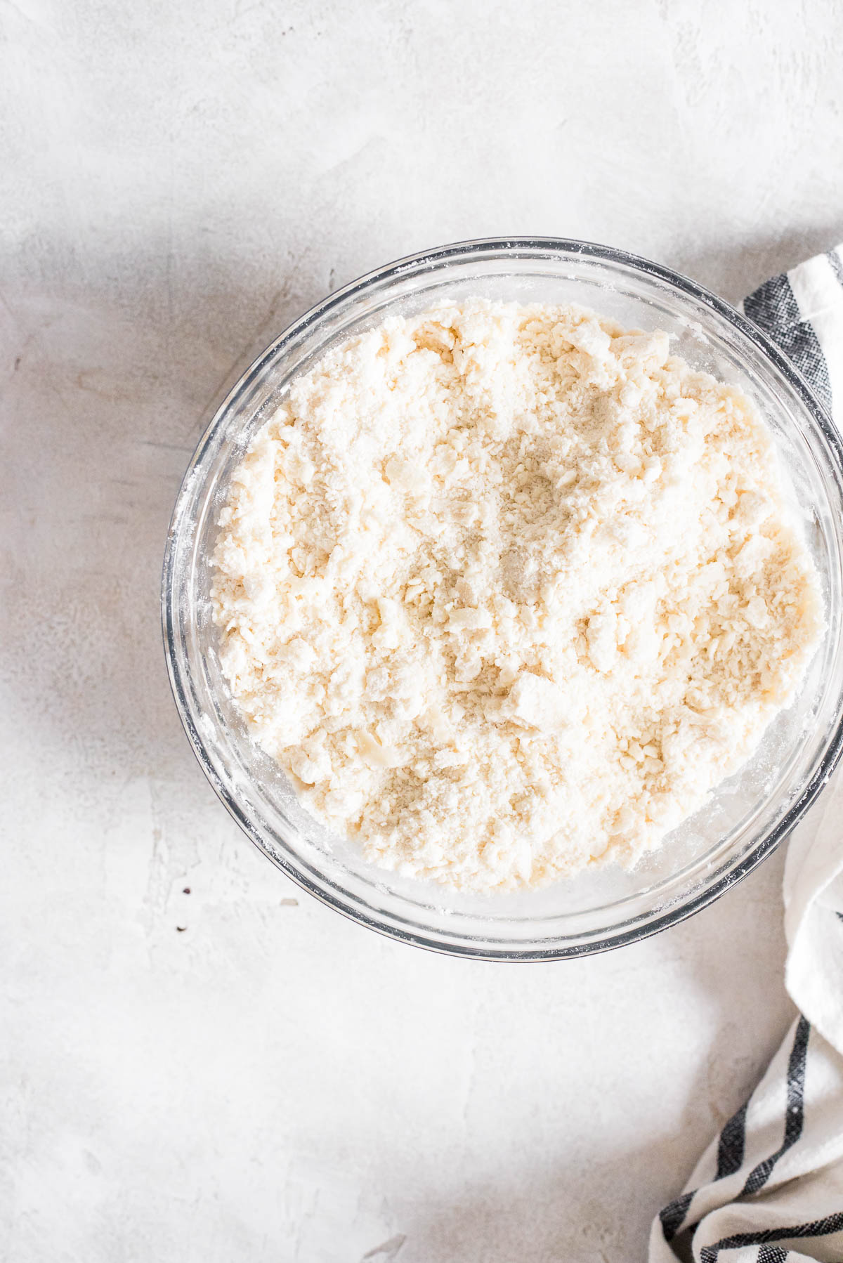 butter cut into flour mixture in bowl