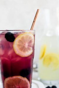 close up of glass of blackberry lemonade