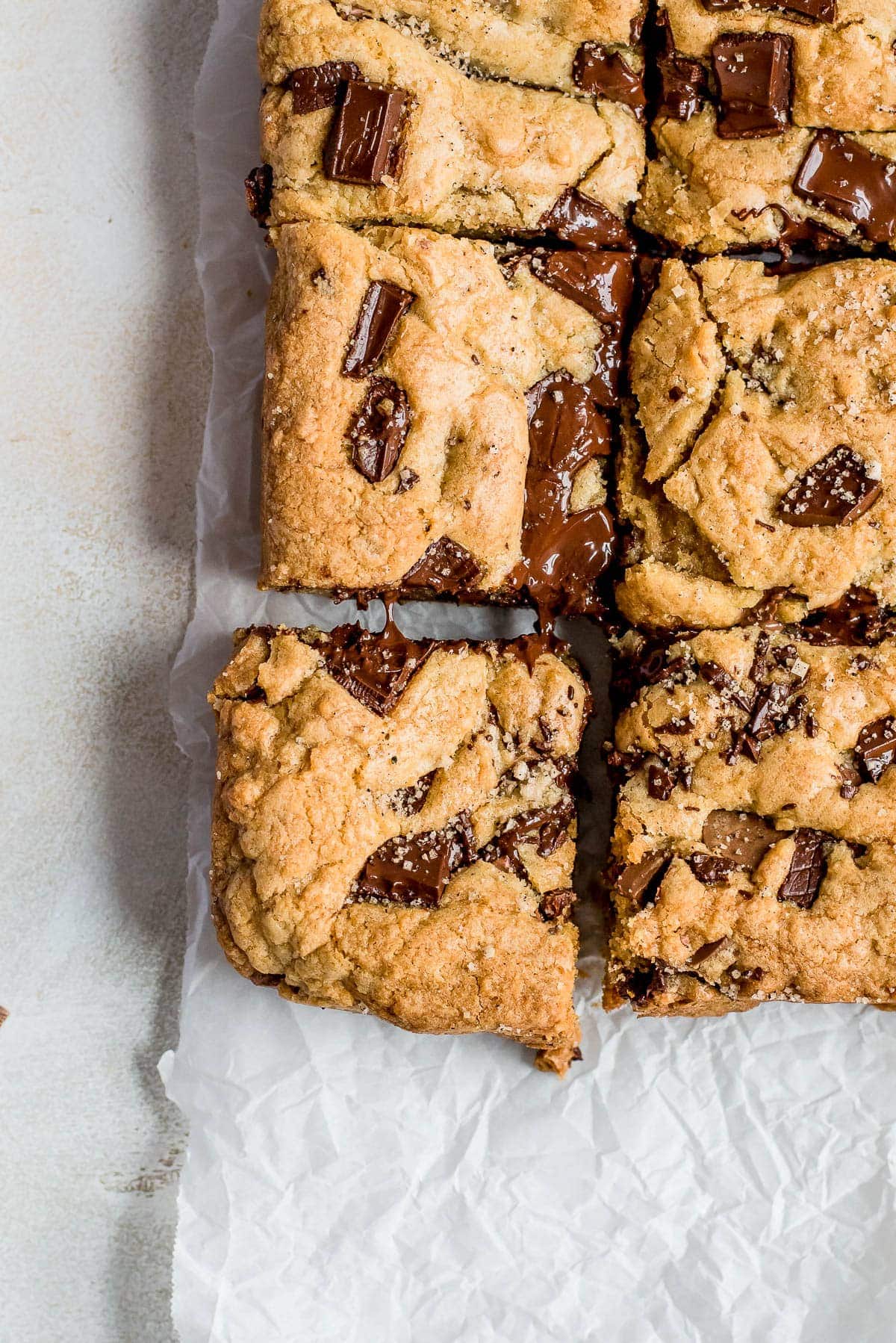 chocolate chip cookie squares on parchment paper close up