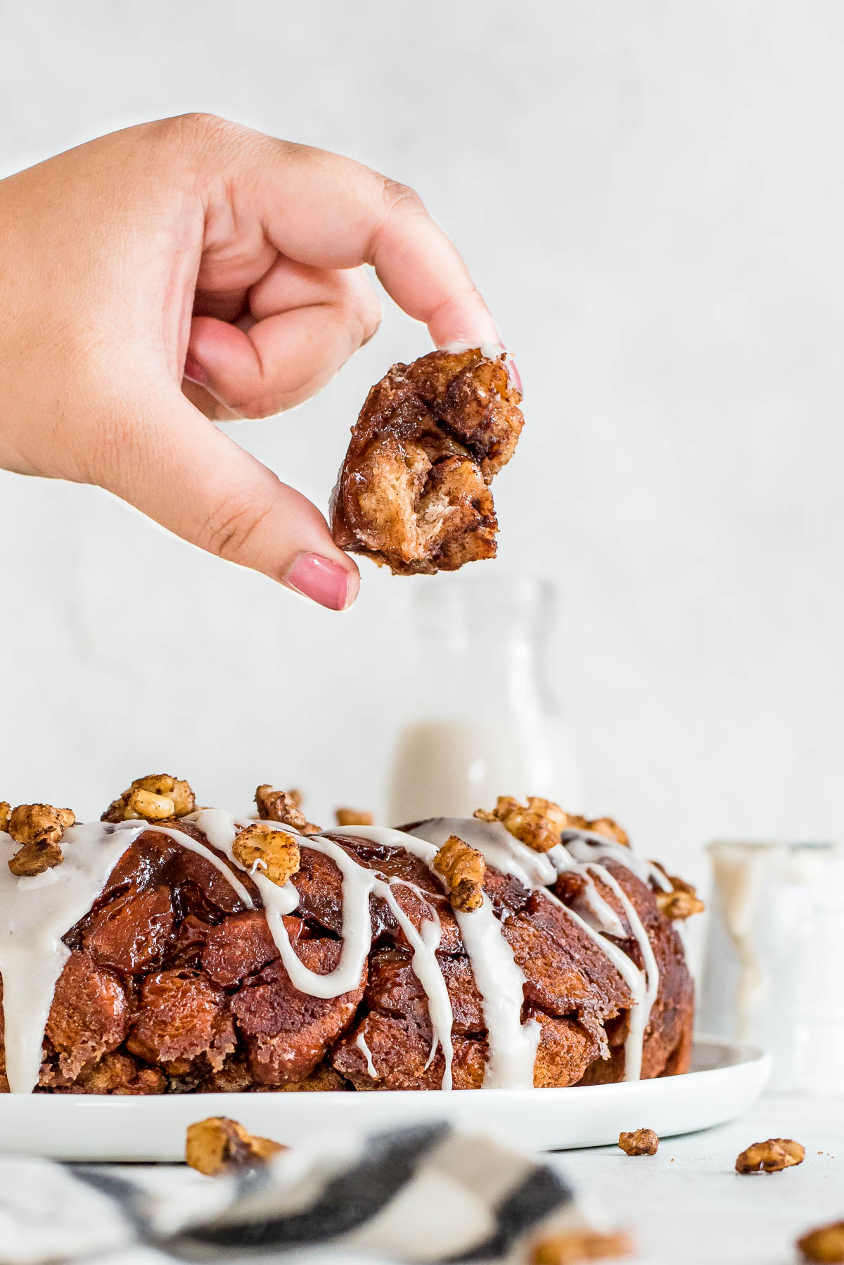 hand holding up piece of monkey bread