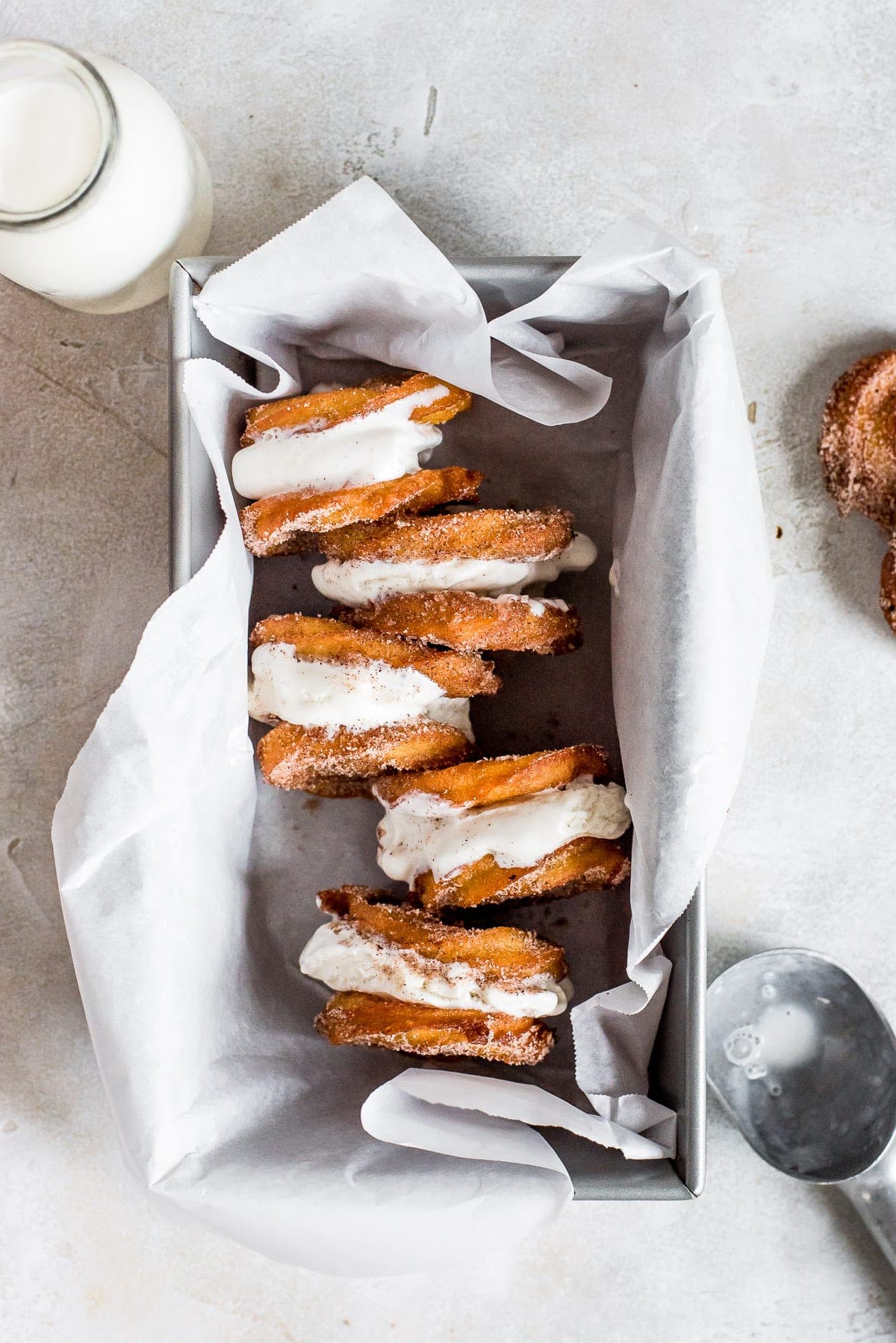 churros sandwiching ice cream stacked in a loaf pan