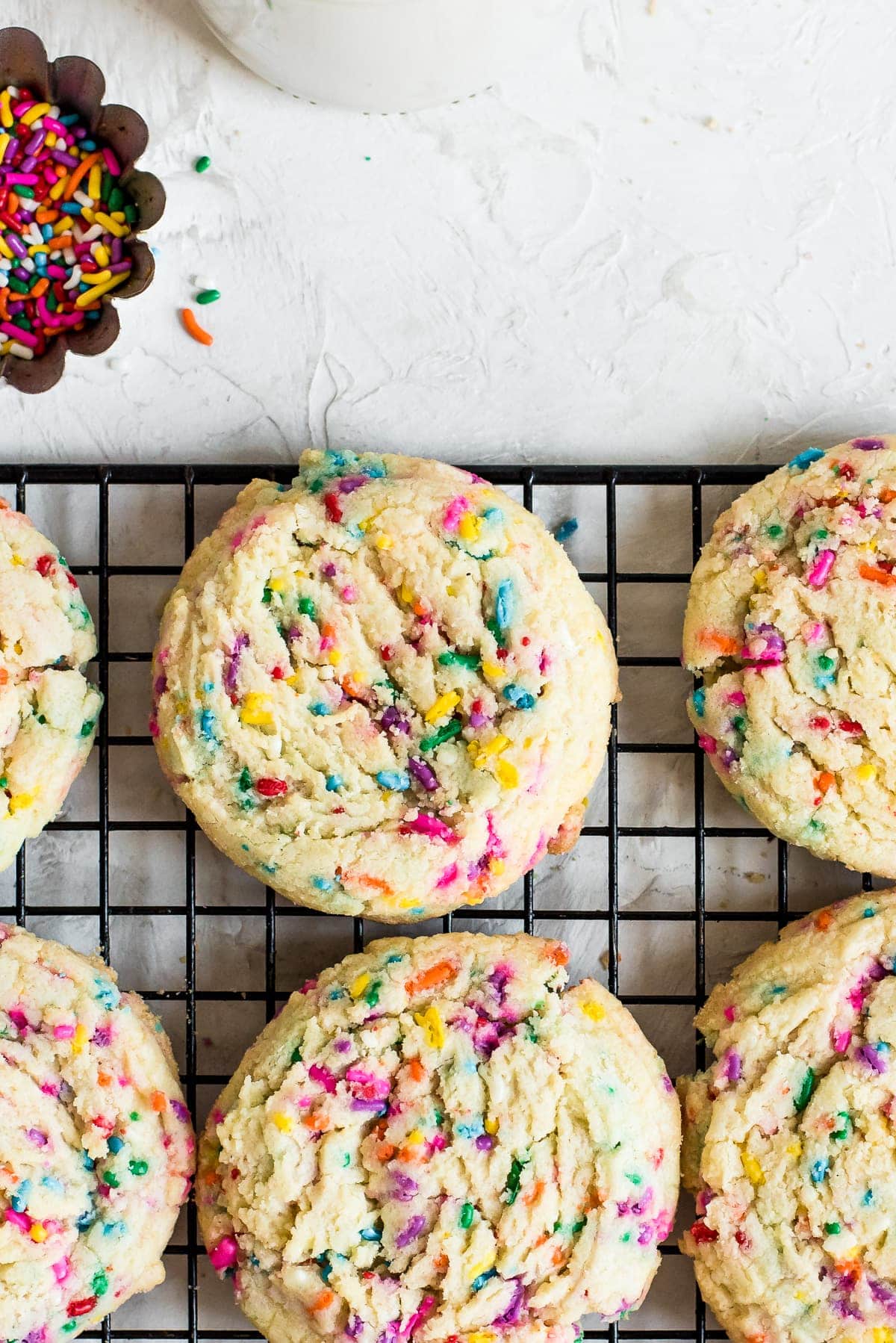 close up of sprinkle sugar cookie on rack