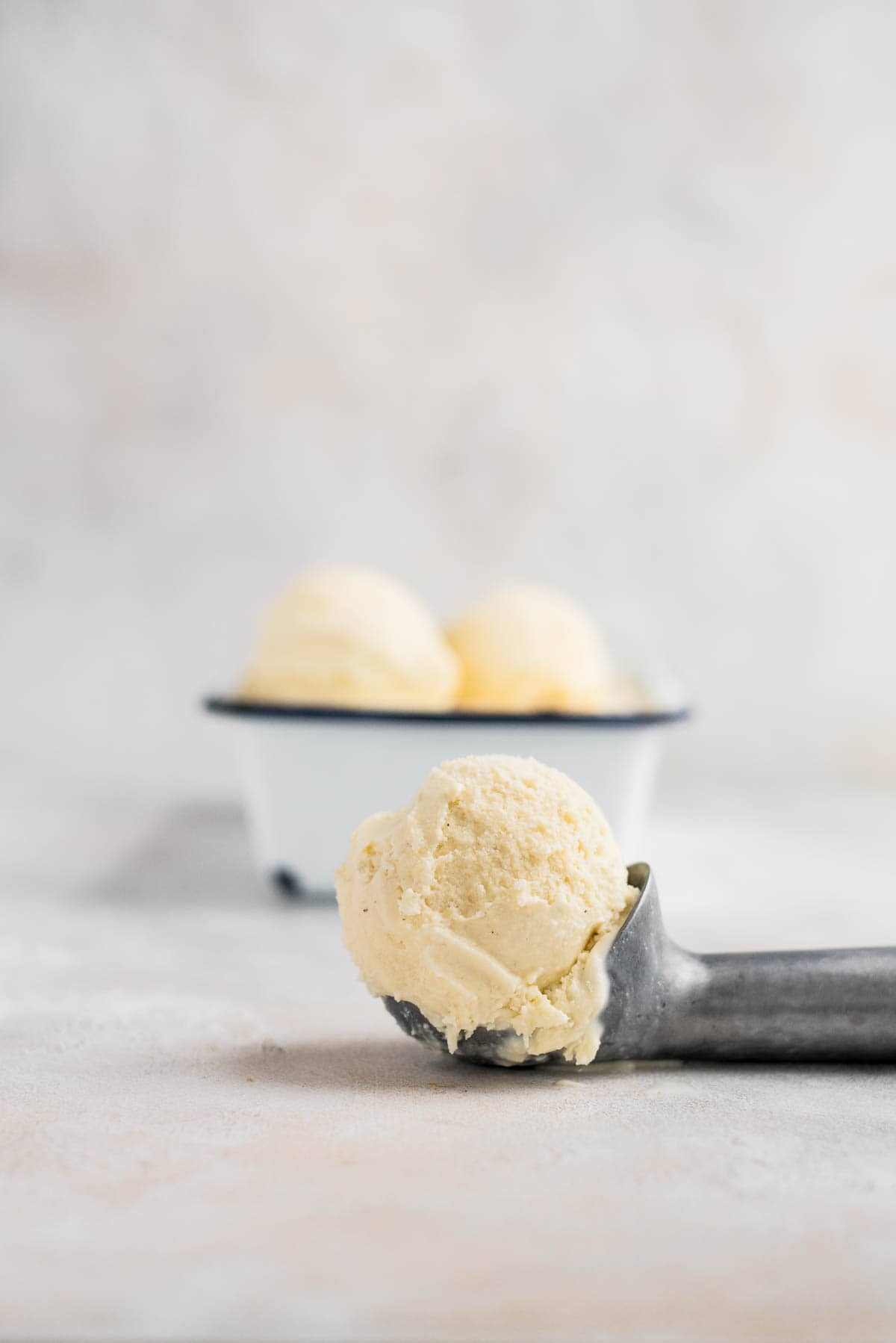 vanilla ice cream in ice cream scoop close up