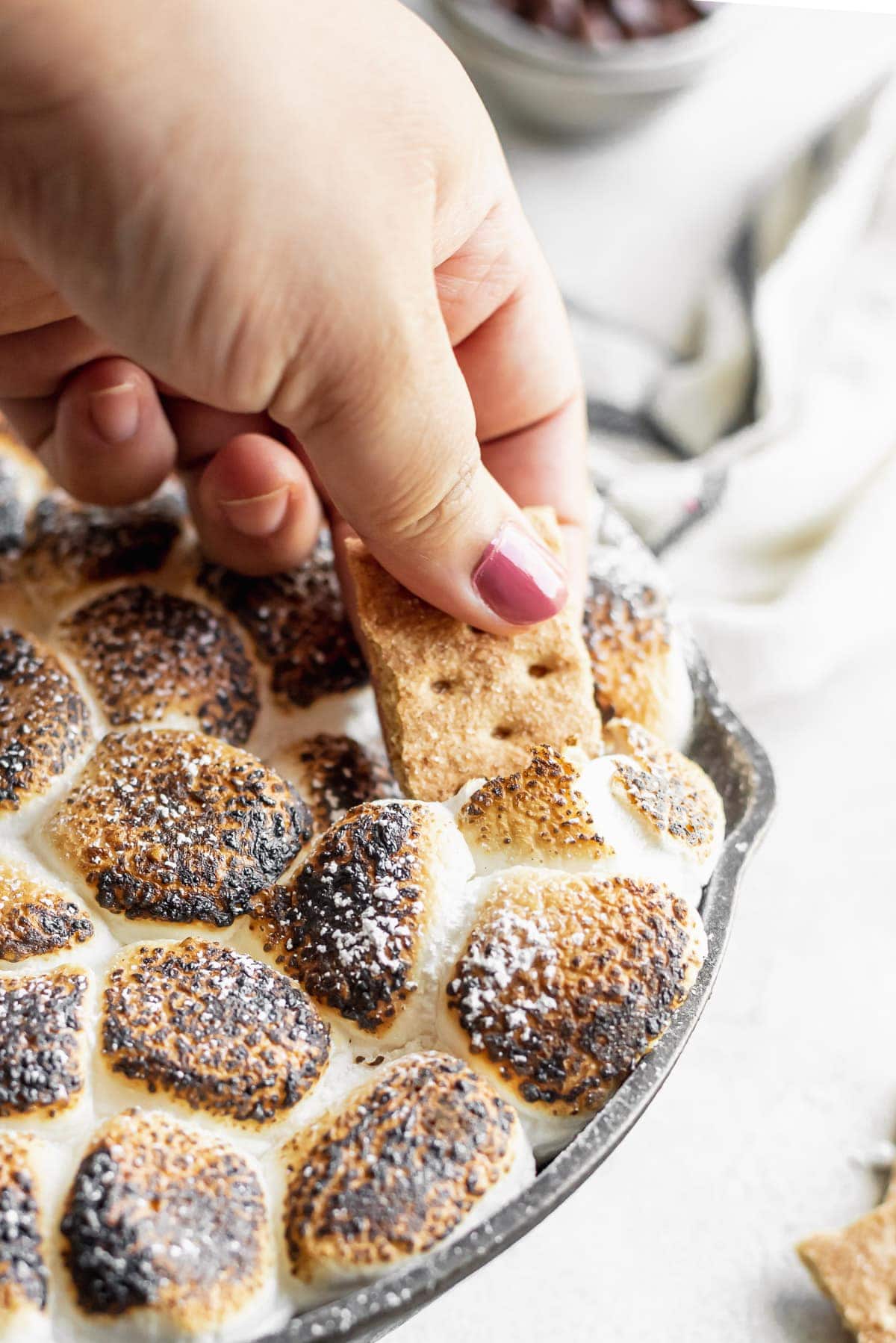 hand scooping dessert dip