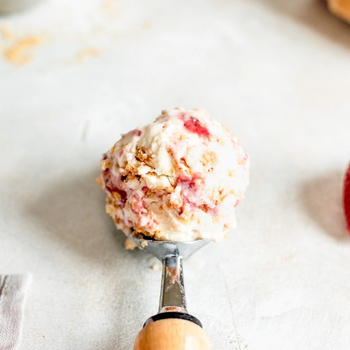 ice cream scoop full of strawberry cheesecake ice cream