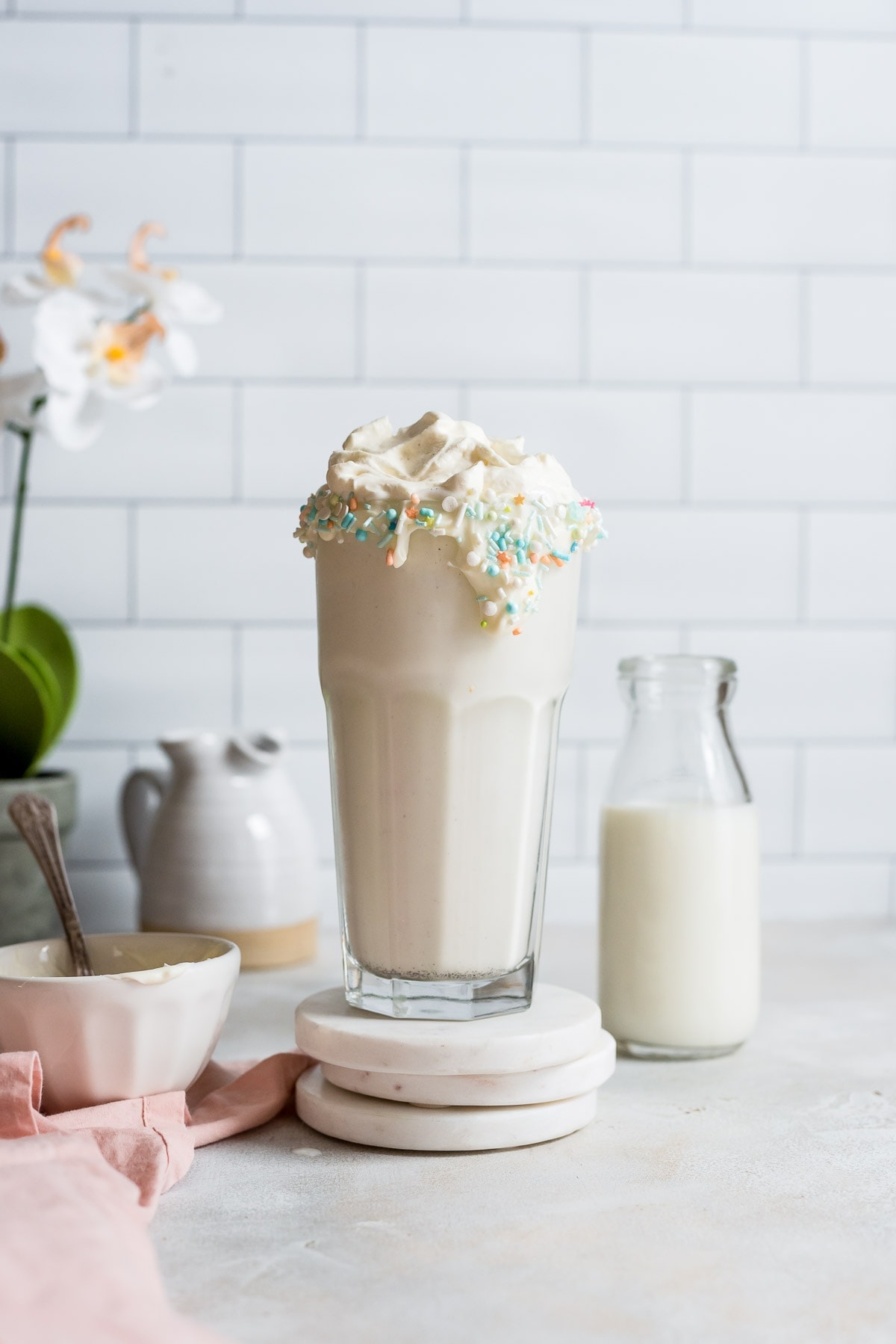 hero shot of milkshake on marble coaster