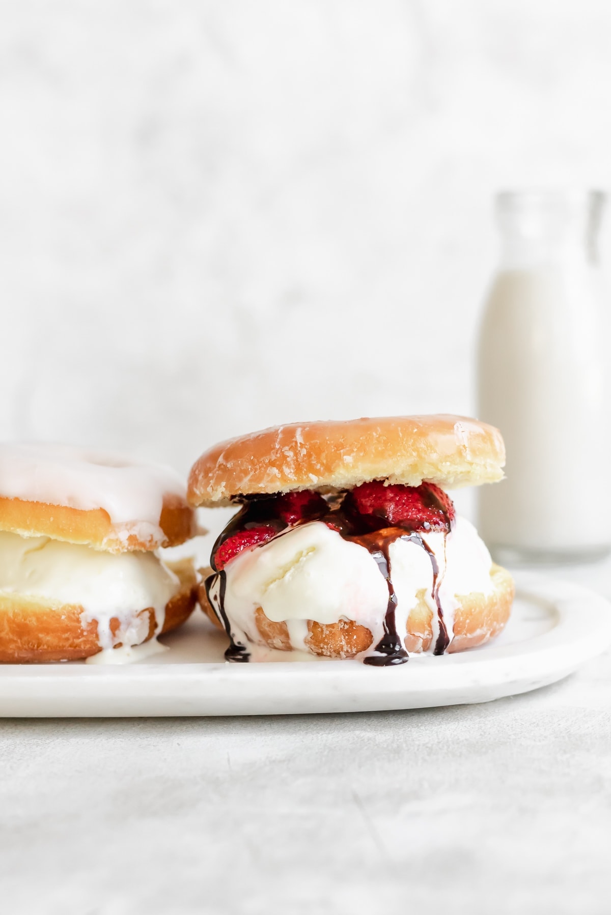 Close Up Still Life of Gourmet Double Scoop Ice Cream Sandwich with Variety  of Flavors Served on Donut with Red Berry Sauce Served on Wooden Paddle  Stock Photo - Alamy