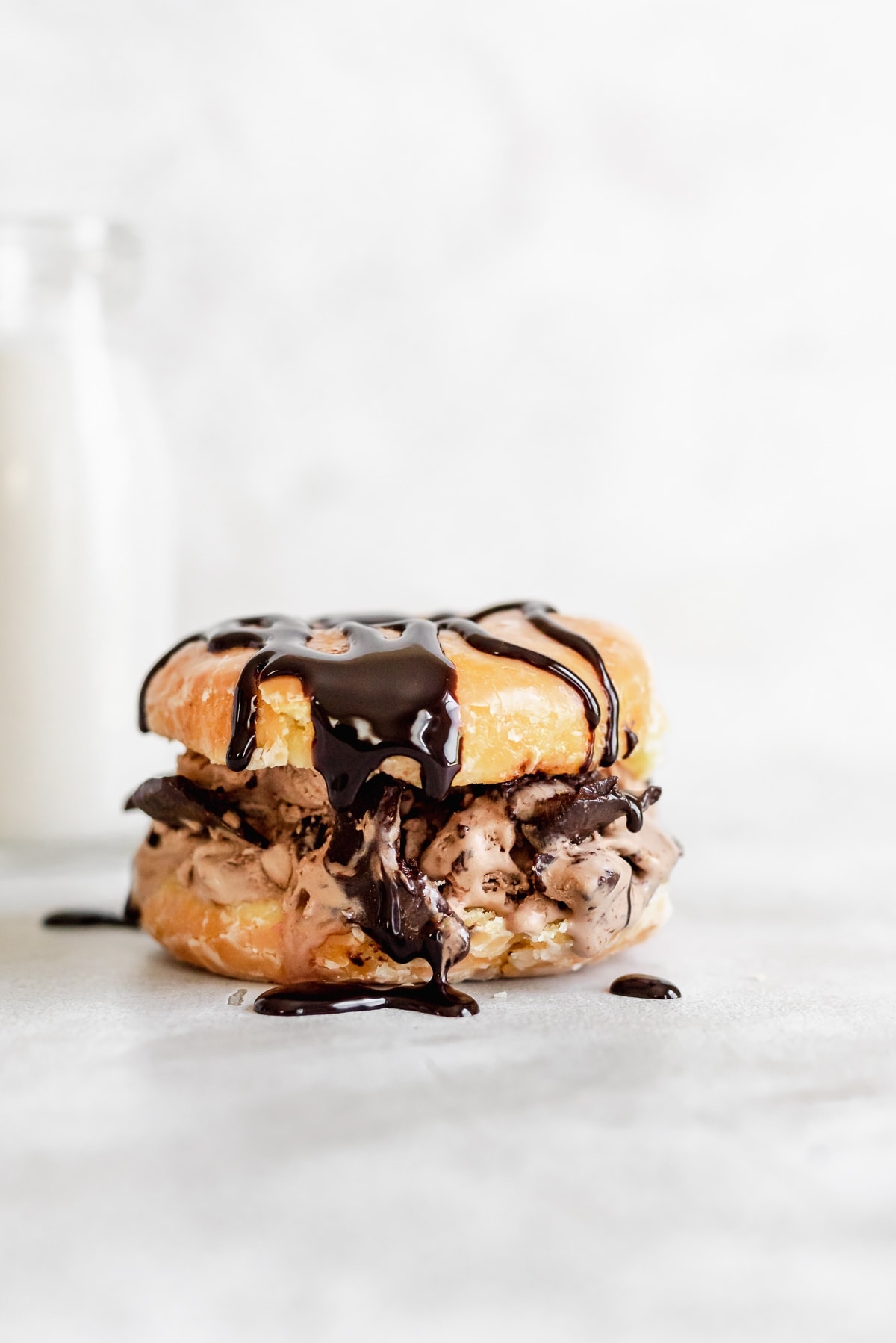 donut ice cream sandwich covered in chocolate