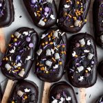 dark chocolate cake pops topped with Halloween sprinkles