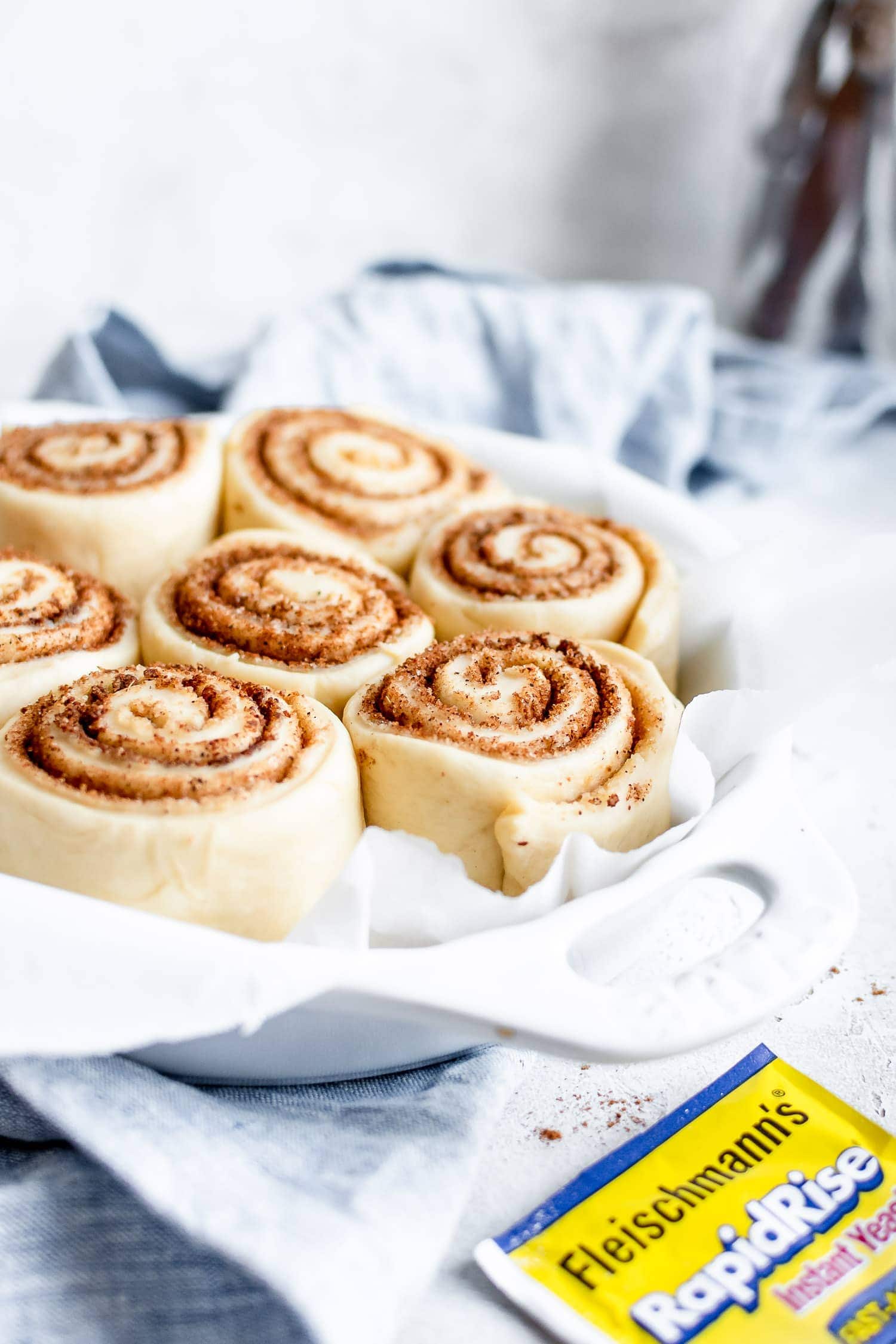 cinnamon rolls about to be baked in the oven