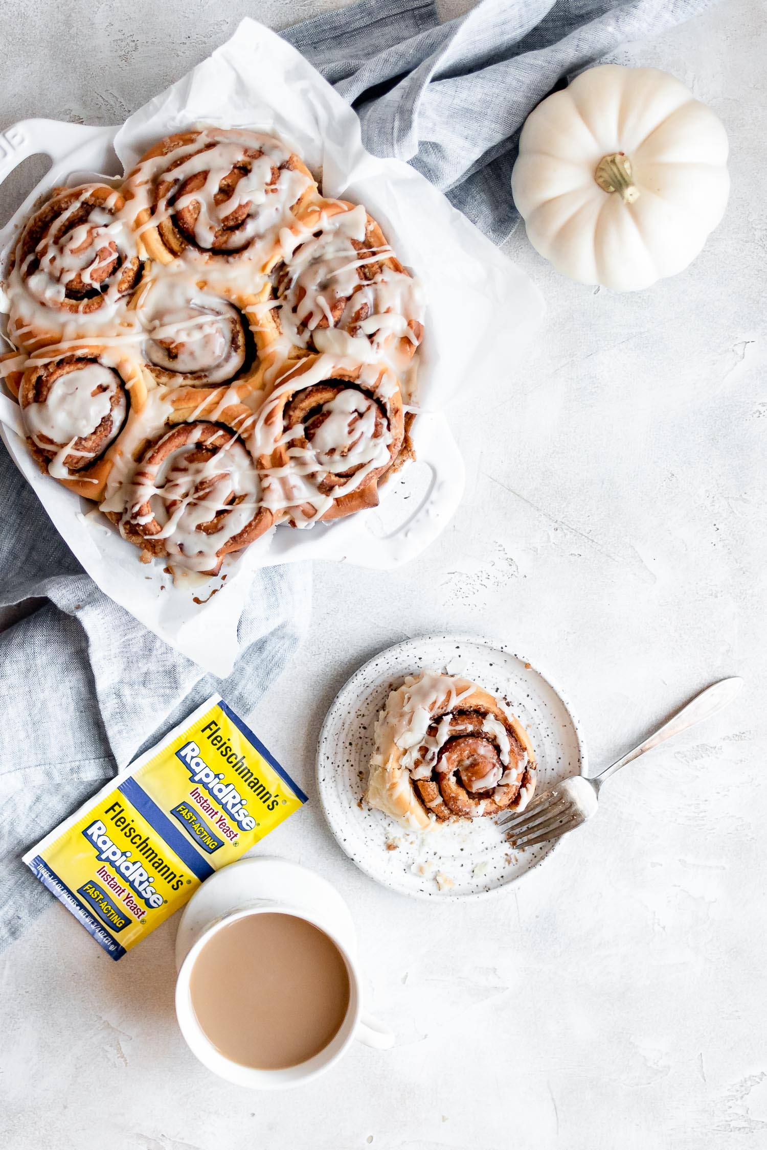 overhead of cinnamon rolls in pan and on plate