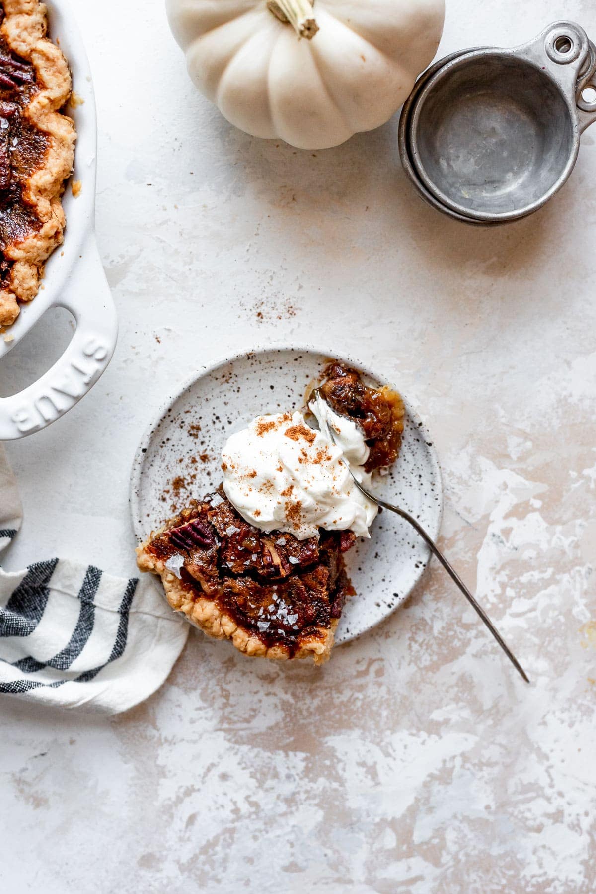 overhead slice of pie with whipped cream