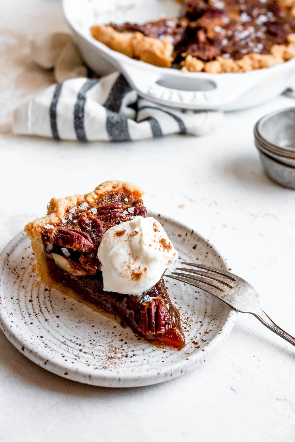 Slice of pecan pie showing off layers