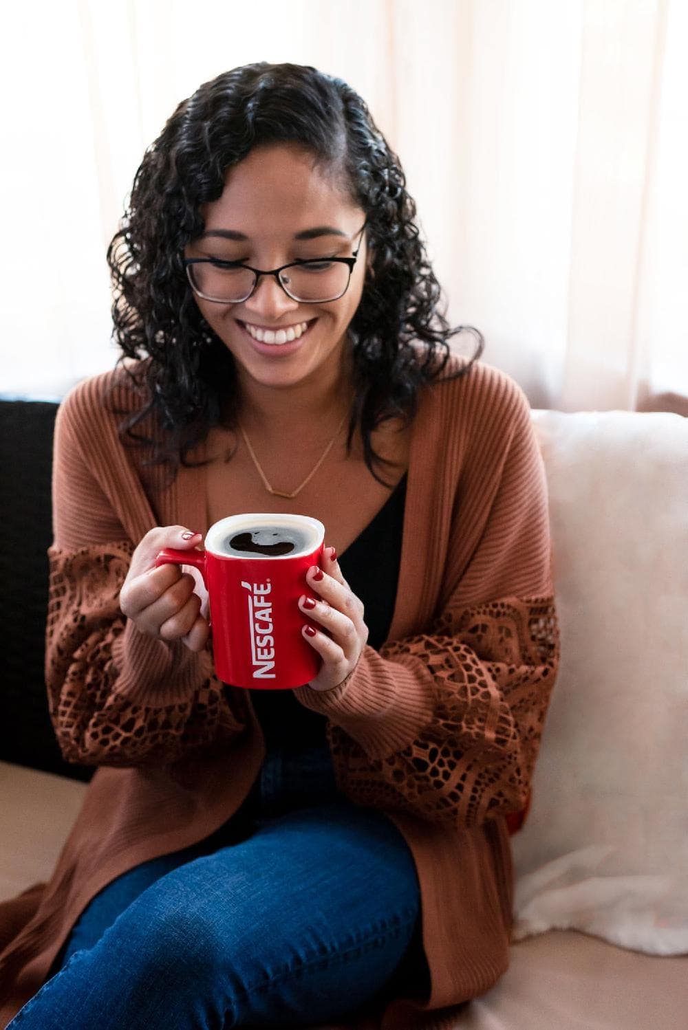 woman holding mug of coffee