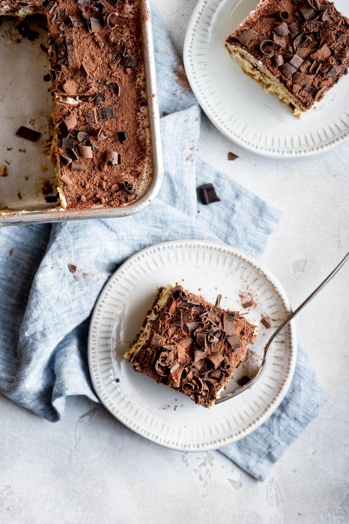 pverheat pan and plate both filled with the tiramisu cake