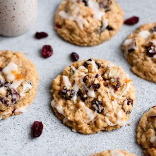 scattered cookies on table with cranberries