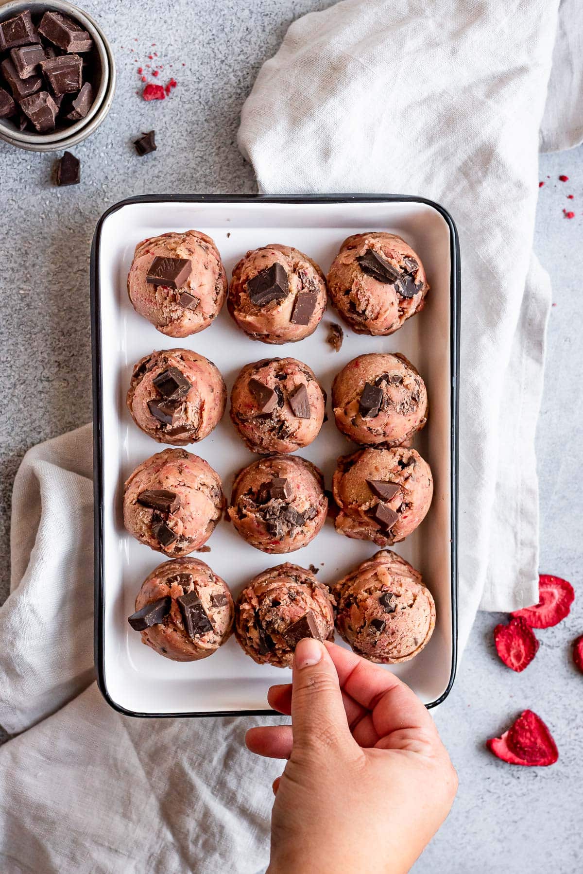 cookie dough portioned out and topped with more chocolate