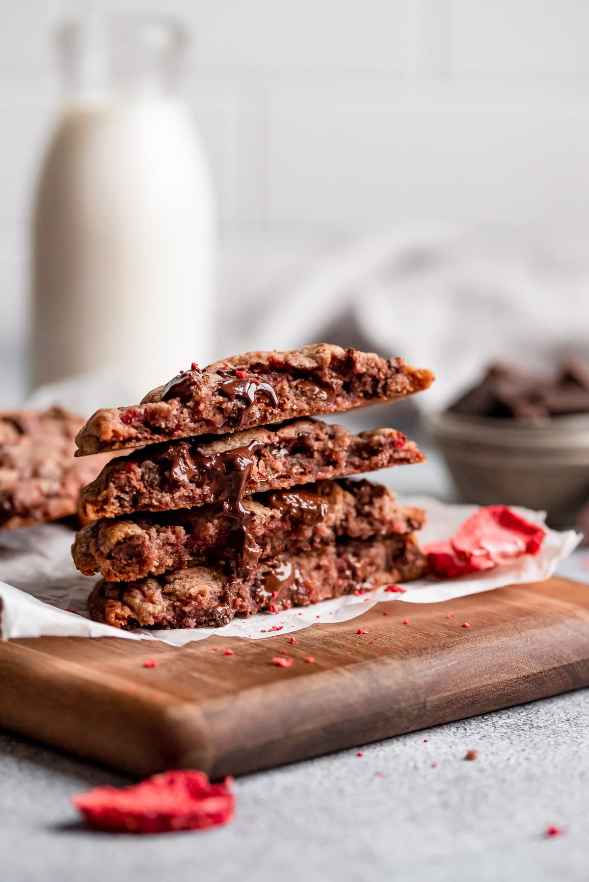 stacked cookies showing gooey chocolate inside