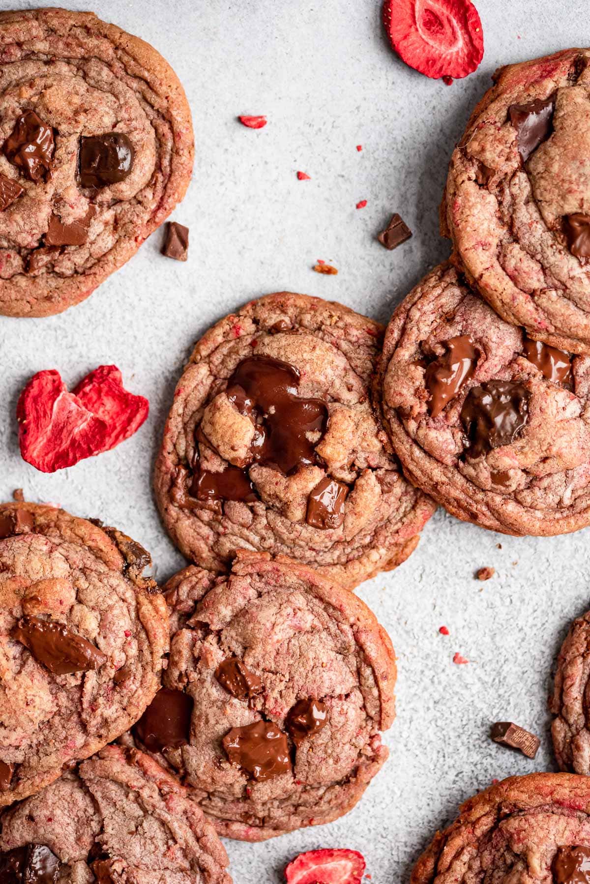 cookies scattered on table with freeze dried strawberries