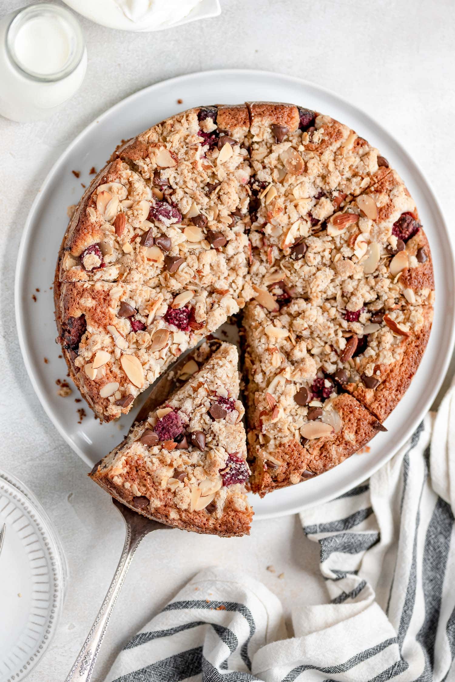 sliced coffee cake with piece being pulled out