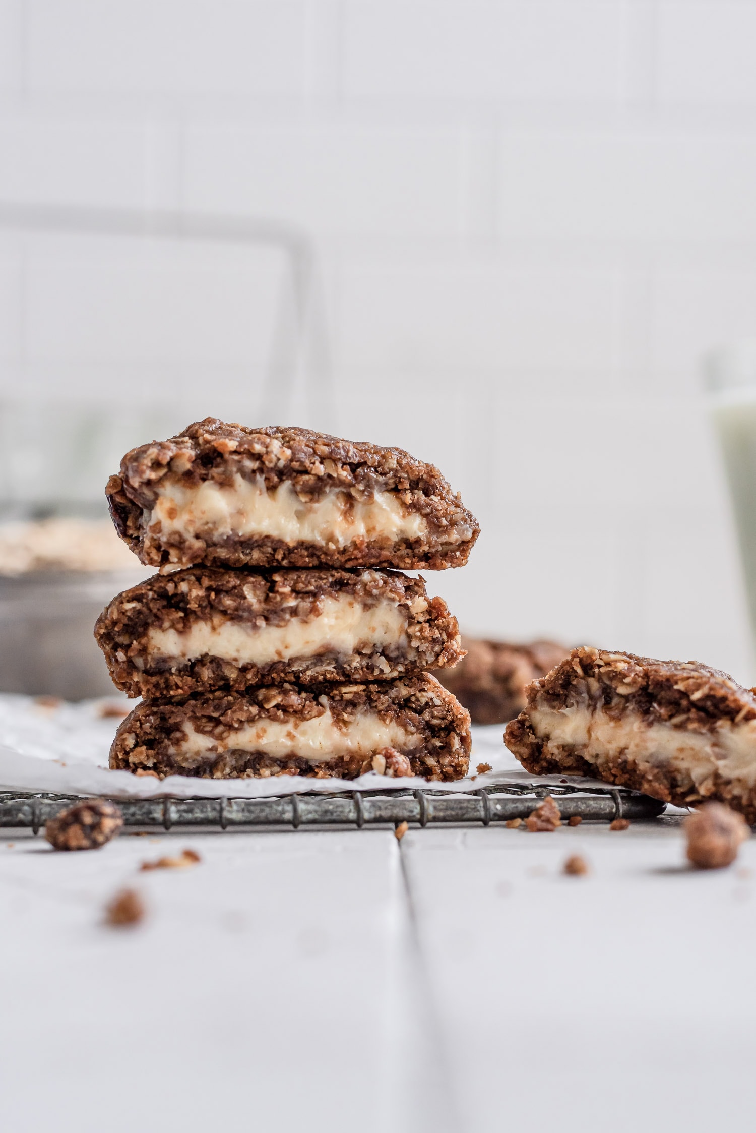 stacked cookies showing cheesecake filling