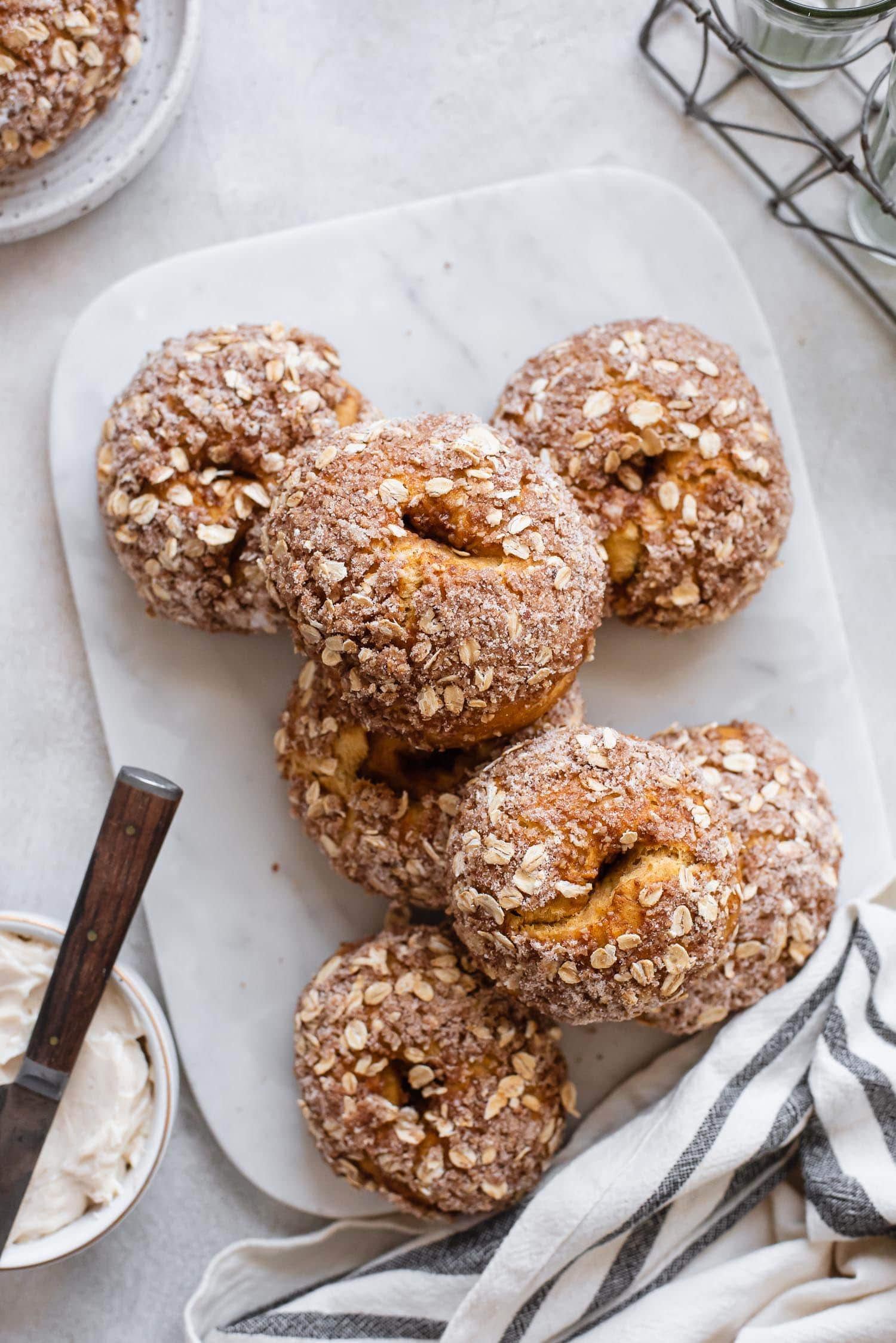 board topped with pumpkin bagels with oat topping
