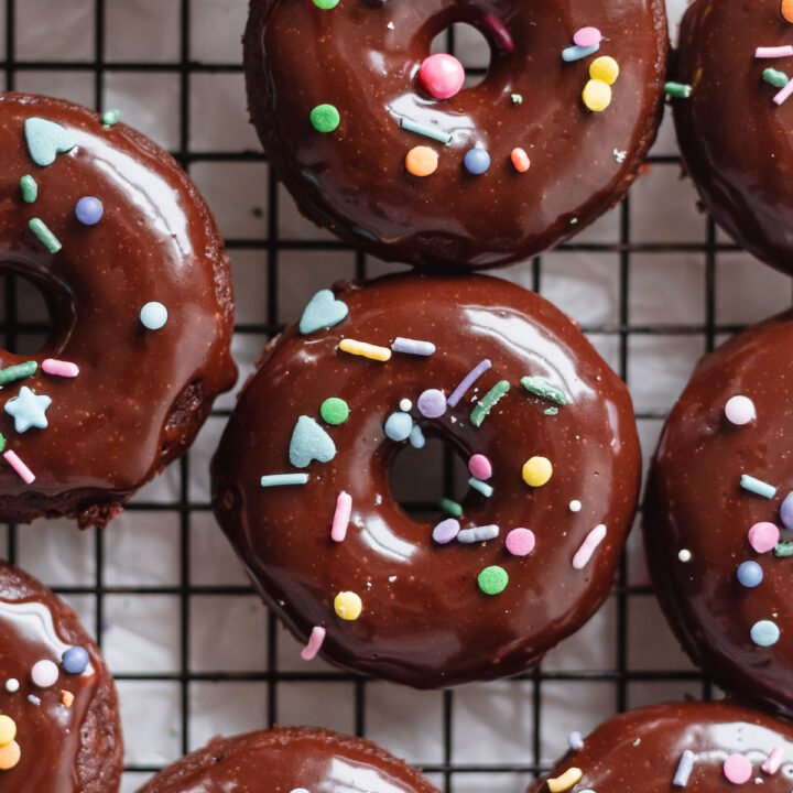 close up finished donuts on rack