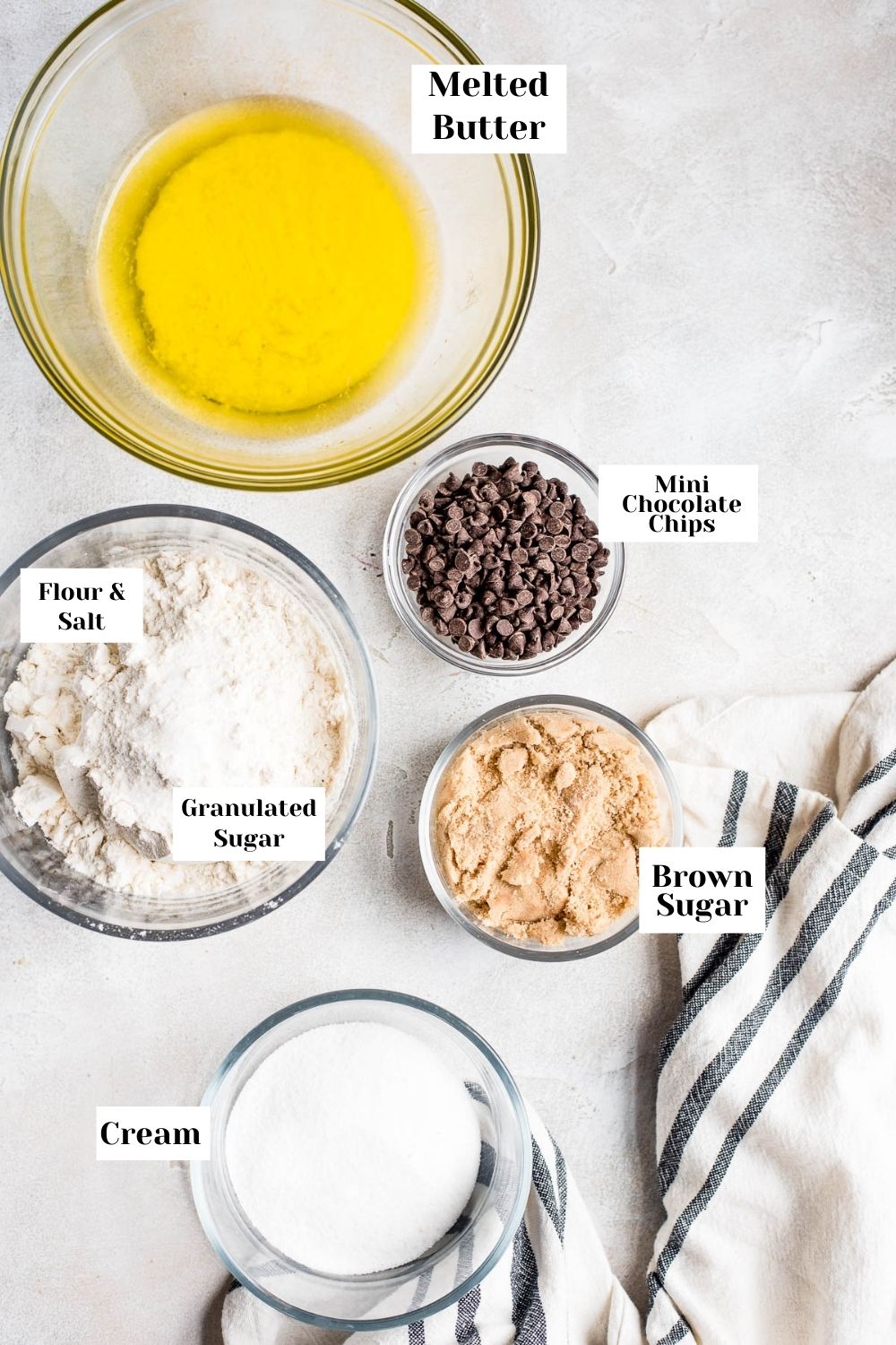 labeled photo of ingredients in bowls for cookie dough 