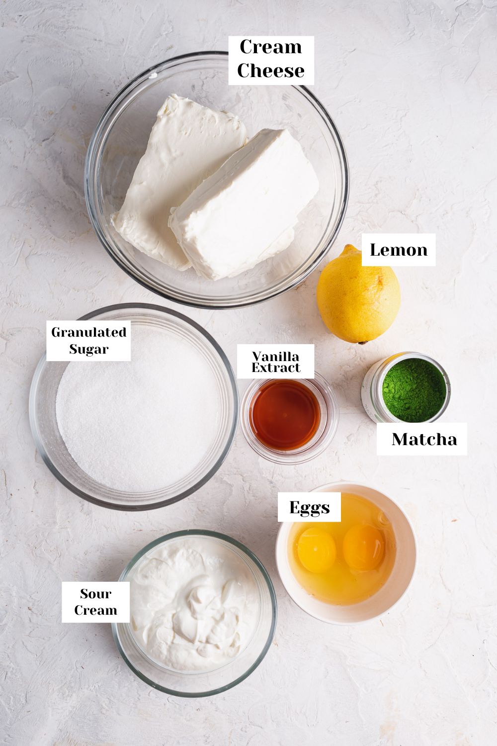 labeled ingredients in bowls for cheesecake