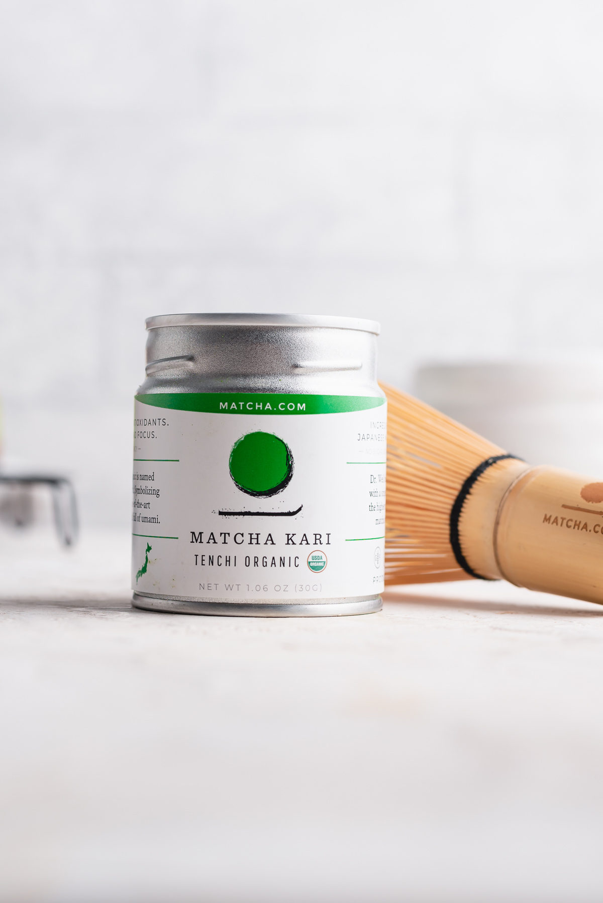 matcha container next to whisk