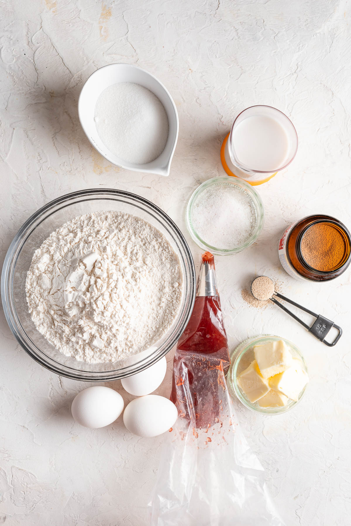 ingredients for jelly donuts in bowls