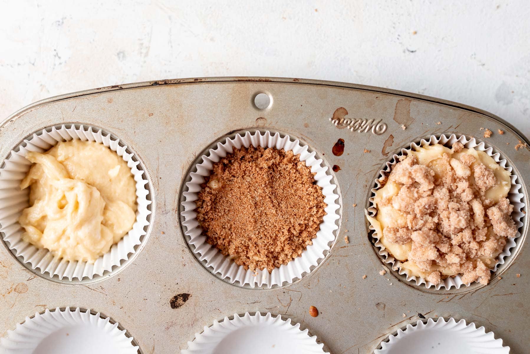steps to layer muffins in liners
